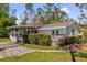 Charming single-story home with screened porch, patio, and lush landscaping at 13128 Devonshire Rd, Orlando, FL 32832