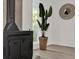 Bright living room featuring a black wood stove, large windows, and hardwood flooring at 13128 Devonshire Rd, Orlando, FL 32832