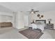 This main bedroom features modern decor, a ceiling fan, and opens to the main living space at 13128 Devonshire Rd, Orlando, FL 32832