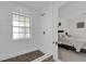 Shower with white subway tile and decorative floor tiles next to bedroom at 13128 Devonshire Rd, Orlando, FL 32832