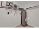 Utility room features a water heater, storage and updated plumbing at 13128 Devonshire Rd, Orlando, FL 32832