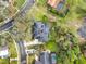 A bird's-eye view emphasizes the home's layout, screened-in pool, solar panels, and surrounding landscaping at 137 Spring Chase Cir, Altamonte Springs, FL 32714