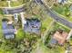 Aerial view showing the property with a pool, solar panels, lush landscaping, and proximity to the neighboring residences at 137 Spring Chase Cir, Altamonte Springs, FL 32714