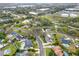 An aerial view shows the neighborhood, nearby community features, and the water tower in the distance at 137 Spring Chase Cir, Altamonte Springs, FL 32714