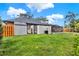 The green backyard features a shed and an entrance to the large screened-in pool area at 137 Spring Chase Cir, Altamonte Springs, FL 32714