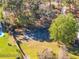 Aerial view of a private basketball court on a well-maintained property surrounded by lush trees at 137 Spring Chase Cir, Altamonte Springs, FL 32714