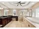 Bathroom features glass shower, a large tub, and tiled surround with window shutters at 137 Spring Chase Cir, Altamonte Springs, FL 32714