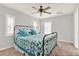 Neutral bedroom featuring a ceiling fan, windows with shutters, and black metal frame bed at 137 Spring Chase Cir, Altamonte Springs, FL 32714