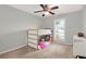 Bright bedroom featuring a bunk bed, ceiling fan, window with shutters and neutral carpeting at 137 Spring Chase Cir, Altamonte Springs, FL 32714