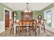 Formal dining room with green walls, a hutch, and a view of the adjacent room at 137 Spring Chase Cir, Altamonte Springs, FL 32714