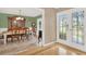 Traditional dining room with hardwood floors, a decorative china cabinet, and a view of the front door at 137 Spring Chase Cir, Altamonte Springs, FL 32714