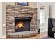 Close up of the beautiful brick fireplace with gas logs and a hearth at 137 Spring Chase Cir, Altamonte Springs, FL 32714