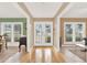 Bright foyer featuring hardwood floors and decorative glass pane double doors at 137 Spring Chase Cir, Altamonte Springs, FL 32714