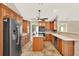 Spacious kitchen featuring custom wood cabinets, stainless steel appliances, and a center island at 137 Spring Chase Cir, Altamonte Springs, FL 32714