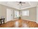 Bright living room with ceiling fan, tray ceiling, and hardwood flooring at 137 Spring Chase Cir, Altamonte Springs, FL 32714