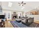 This cozy living room has vaulted ceilings, skylights, and a brick fireplace at 137 Spring Chase Cir, Altamonte Springs, FL 32714