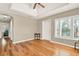 Bright living room with ceiling fan, tray ceiling, and hardwood flooring at 137 Spring Chase Cir, Altamonte Springs, FL 32714