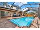 Inviting screened-in pool featuring brick surround, an outdoor kitchen, and a covered patio seating area at 137 Spring Chase Cir, Altamonte Springs, FL 32714