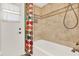 Shower featuring neutral colored tile, a shower head and a colorful shower curtain at 137 Spring Chase Cir, Altamonte Springs, FL 32714