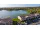 Aerial view of waterfront condos and nearby parking at 145 N Pearl Lake Cswy # 104, Altamonte Springs, FL 32714