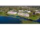 Aerial view of waterfront condos on a lake at 145 N Pearl Lake Cswy # 104, Altamonte Springs, FL 32714