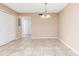 Bright dining room features tile flooring and decorative chandelier at 145 N Pearl Lake Cswy # 104, Altamonte Springs, FL 32714