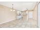 Cozy kitchen with tile flooring, white cabinets, and efficient layout for cooking convenience at 145 N Pearl Lake Cswy # 104, Altamonte Springs, FL 32714