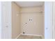 An empty laundry room with tile floors, white wire shelving, and hookups at 145 N Pearl Lake Cswy # 104, Altamonte Springs, FL 32714