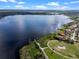 An aerial view of the lake and community golf course with beautiful blue skies at 15144 Spinnaker Cove Ln, Winter Garden, FL 34787