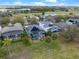 Aerial shot of homes featuring screened in pools and solar panels in the backyard at 15144 Spinnaker Cove Ln, Winter Garden, FL 34787