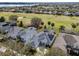 An elevated view of the home shows solar panels and a screened-in pool, with easy access to the golf course and neighboring community at 15144 Spinnaker Cove Ln, Winter Garden, FL 34787