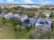 Beautiful aerial view of homes with screened-in pools, green lawns, and solar panels in a picturesque neighborhood at 15144 Spinnaker Cove Ln, Winter Garden, FL 34787