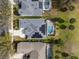 Top-down shot of house showing property lines, screened-in pool, driveway, and solar panels at 15144 Spinnaker Cove Ln, Winter Garden, FL 34787