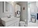 Bright bathroom featuring a white vanity and coordinated towels at 15144 Spinnaker Cove Ln, Winter Garden, FL 34787