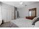 Bedroom featuring a bed, dresser, closet, and a window at 15144 Spinnaker Cove Ln, Winter Garden, FL 34787