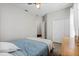 Bedroom featuring a ceiling fan, closet, and a blue striped comforter at 15144 Spinnaker Cove Ln, Winter Garden, FL 34787