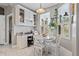 Charming breakfast nook with marble table and shuttered window, and a built-in desk at 15144 Spinnaker Cove Ln, Winter Garden, FL 34787