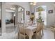 Elegant dining area with a bright window, neutral color palette, and seamless flow to the living spaces at 15144 Spinnaker Cove Ln, Winter Garden, FL 34787