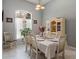 Bright dining room featuring a window, neutral color palette, and modern furnishings at 15144 Spinnaker Cove Ln, Winter Garden, FL 34787