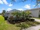 Attractive single-story home with lush landscaping and well-maintained lawn at 15144 Spinnaker Cove Ln, Winter Garden, FL 34787