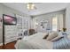 Relaxing main bedroom features white furnishings, a ceiling fan, and access to the lanai at 15144 Spinnaker Cove Ln, Winter Garden, FL 34787