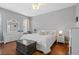 Light-filled main bedroom featuring a ceiling fan and hardwood floors at 15144 Spinnaker Cove Ln, Winter Garden, FL 34787