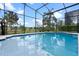 In-ground pool and patio, showcasing the beautiful landscaping surrounding the property at 15144 Spinnaker Cove Ln, Winter Garden, FL 34787