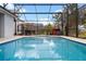 Beautiful in-ground screened pool and spa with a playhouse at 15144 Spinnaker Cove Ln, Winter Garden, FL 34787