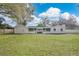 Expansive backyard featuring a screen porch and a newly installed stone patio, perfect for outdoor enjoyment at 1536 Errol Pkwy, Apopka, FL 32712