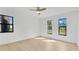 Bright bedroom with ample sunlight, modern flooring and multiple windows at 1536 Errol Pkwy, Apopka, FL 32712