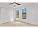 Light bedroom with closet, two windows, ceiling fan and modern flooring at 1536 Errol Pkwy, Apopka, FL 32712