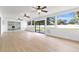 Large living room featuring hardwood floors, recessed lights and sliding glass doors overlooking the backyard at 1536 Errol Pkwy, Apopka, FL 32712