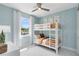 Comfortable bedroom featuring a bunk bed, light blue walls, and cozy decor at 15919 Winding Bluff Dr, Montverde, FL 34756