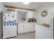 Efficient kitchen featuring white cabinetry, countertops and modern appliances at 1707 Wilton Ave, Orlando, FL 32805